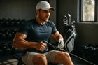 Athlete performing a back exercise using a resistance cable in a gym, showcasing strength training for golf fitness.