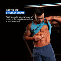 A muscular man applying CYTOLEAN CREAM - THERMOGENIC WORKOUT CREAM by Gaspari Nutrition on his abs, showcasing proper usage for optimal results.