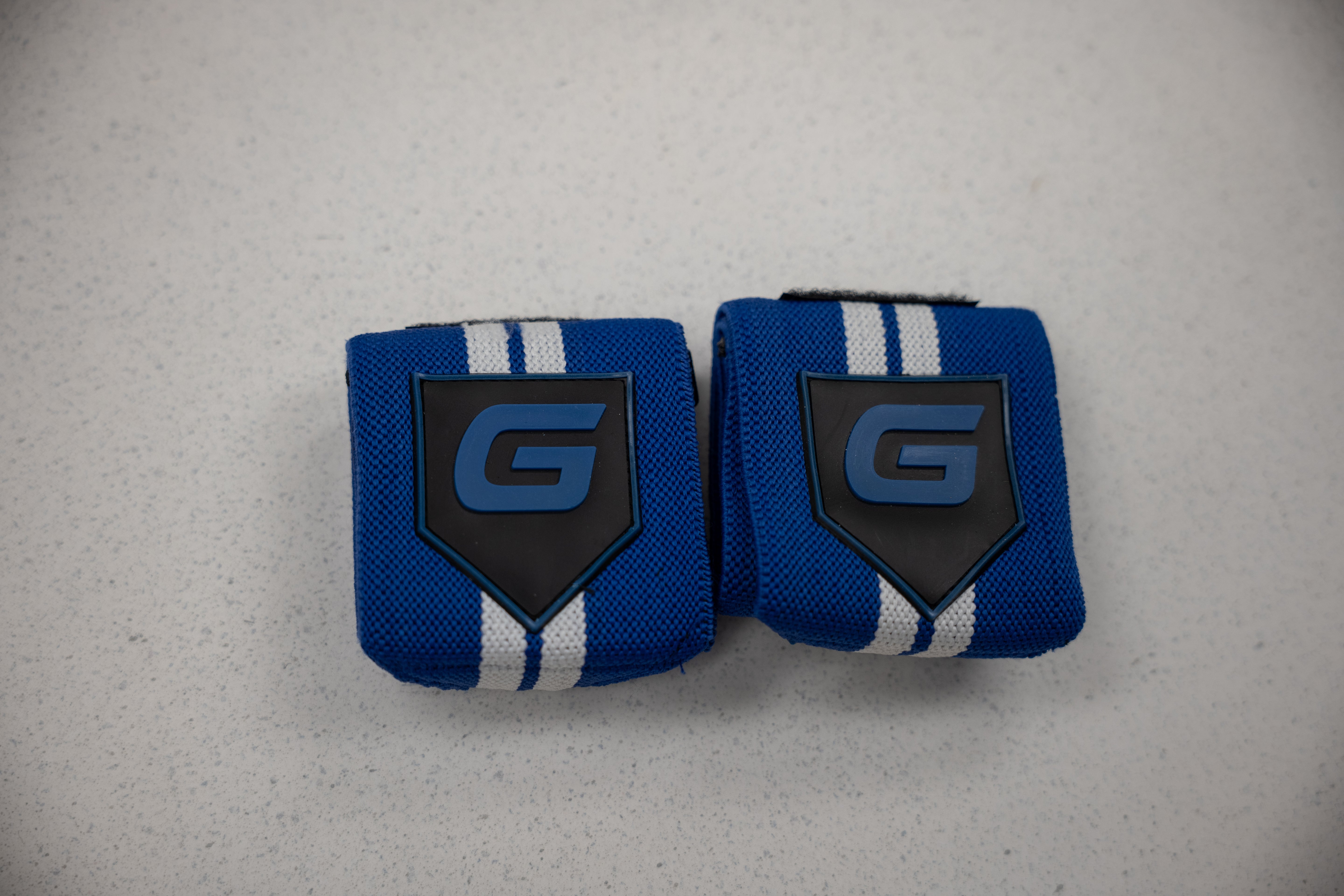 Gaspari Wrist Wraps in vibrant blue, featuring a sleek design to boost performance in workouts.