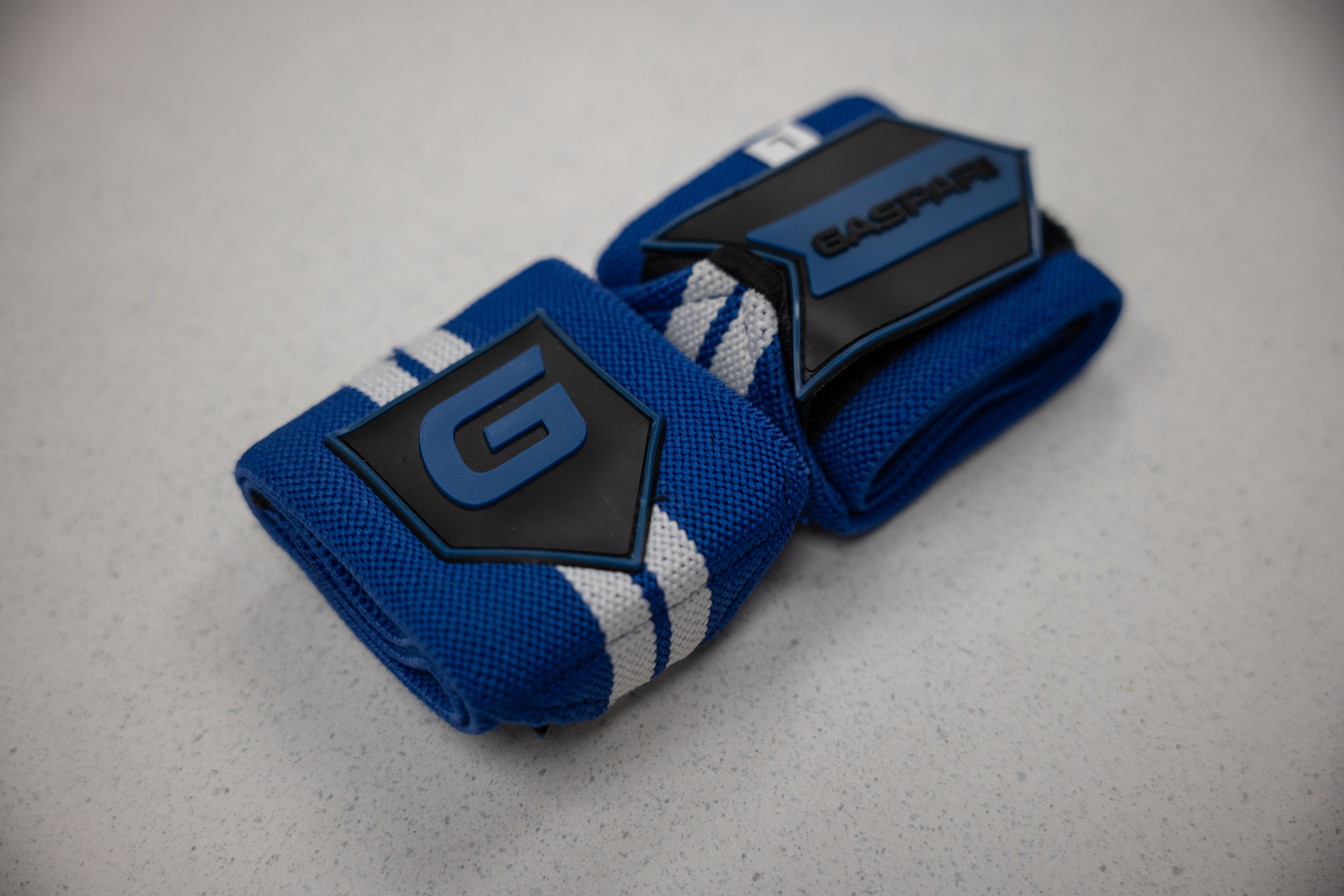 Gaspari Wrist Wraps in a blue color scheme, designed for athletes looking for added wrist stability.